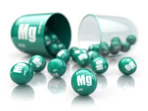 Capsule met magnesium (Mg). Voedingssupplementen. Vitaminecapsule geïsoleerd op wit. 3D-illustratie.